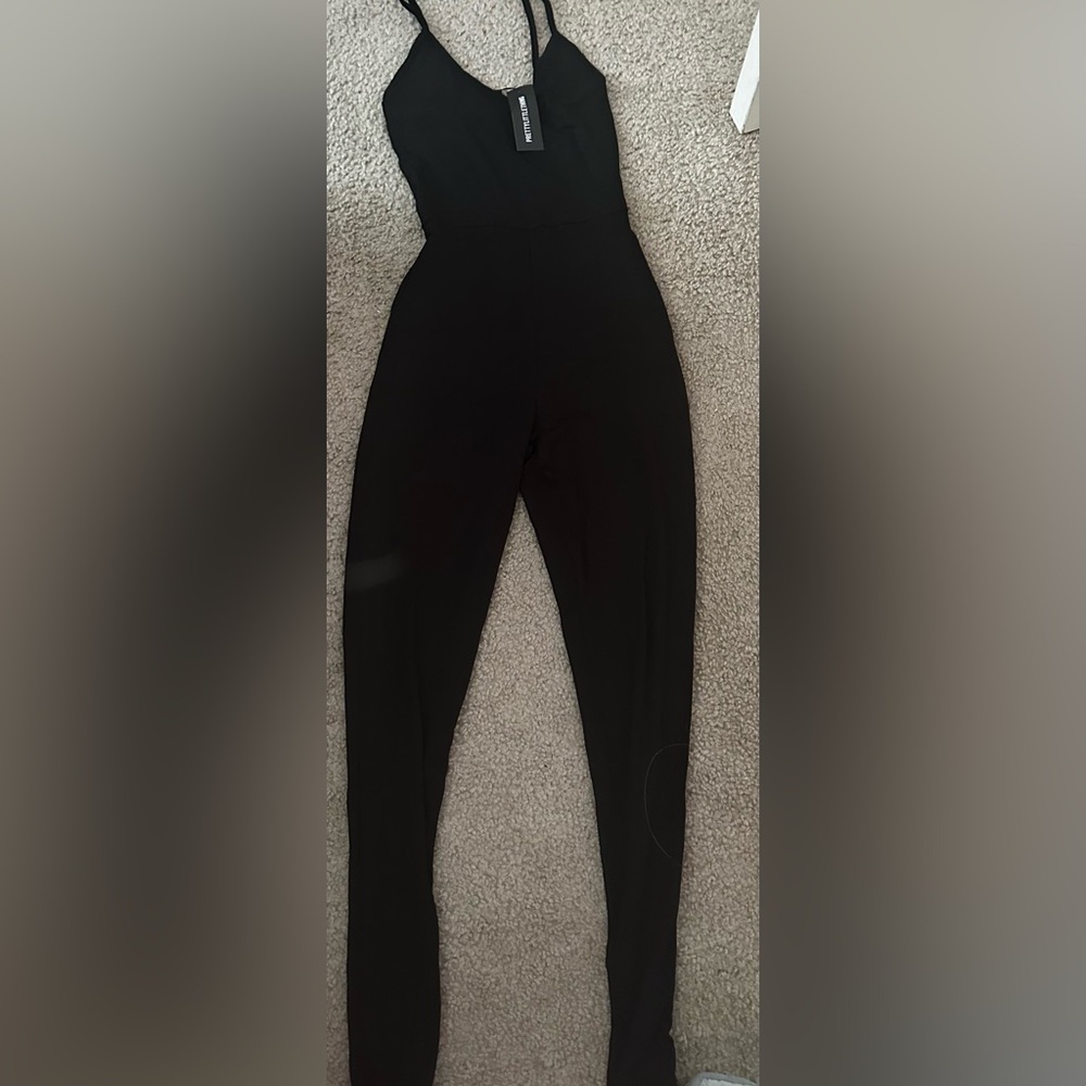 Pretty little thing- black jump suit brand new size xsmall women’s - petite